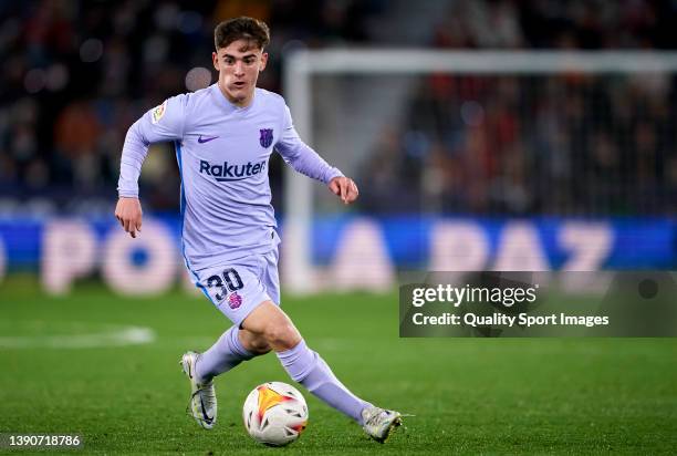 Pablo Gavi of FC Barcelona runs with the ball during the La Liga Santander match between Levante UD and FC Barcelona at Ciutat de Valencia Stadium on...