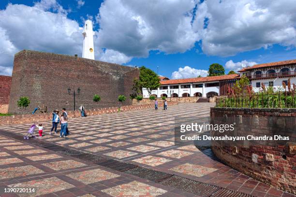 guatavita, colombia: looking across a sloping town square in the andes town towards municipal buildings and hotels. spanish colonial style of architecture. - cundinamarca stock pictures, royalty-free photos & images