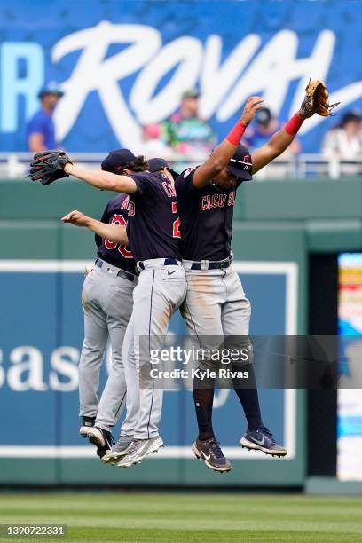 Oscar Mercado, Steven Kwan and Myles Straw of the Cleveland Guardians celebrate after defeating the Kansas City Royals at Kauffman Stadium on April...