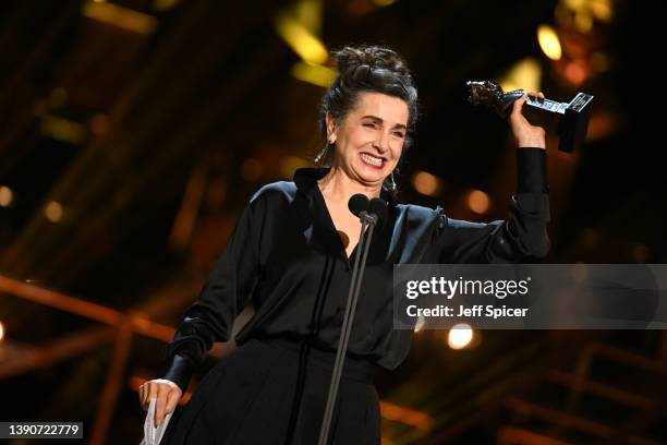 Lisa Sadovy accepts the award for Best Actress in a Supporting Role in a Musical for "Cabaret" during The Olivier Awards 2022 with MasterCard at the...