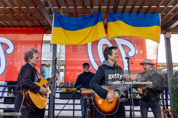 Michael Bacon and Kevin Bacon of The Bacon Brothers perform during a benefit concert for Ukraine at Dacha Beer Garden at the Navy Yard on April 10,...