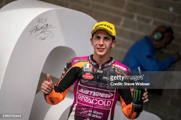 Moto3 rider Andrea Migno of Italy and Rivacold Snipers Team signs the "500th GP" sculpture at parc ferme during the race of the MotoGP of USA at the...