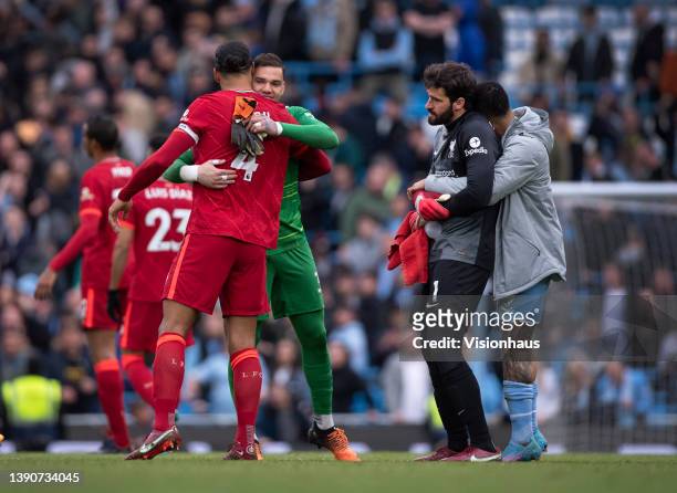 Manchester City goalkeeper Ederson and Virgil van Dijk of Liverpool greet each other after the Premier League match between Manchester City and...