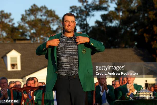 Scottie Scheffler is awarded the Green Jacket by 2021 Masters champion Hideki Matsuyama of Japan during the Green Jacket Ceremony after he won the...