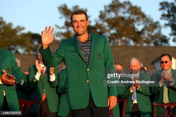 Scottie Scheffler celebrates after being awarded the Green Jacket during the Green Jacket Ceremony after winning the Masters at Augusta National Golf...