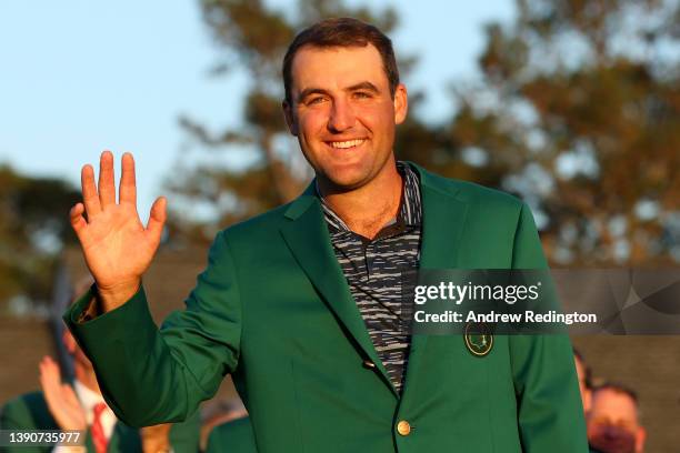 Scottie Scheffler celebrates after being awarded the Green Jacket during the Green Jacket Ceremony after winning the Masters at Augusta National Golf...