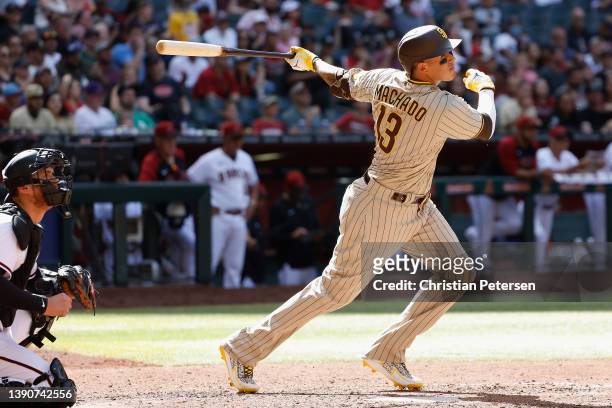 Manny Machado of the San Diego Padres hits a RBI double against the Arizona Diamondbacks during the sixth inning of the MLB game at Chase Field on...