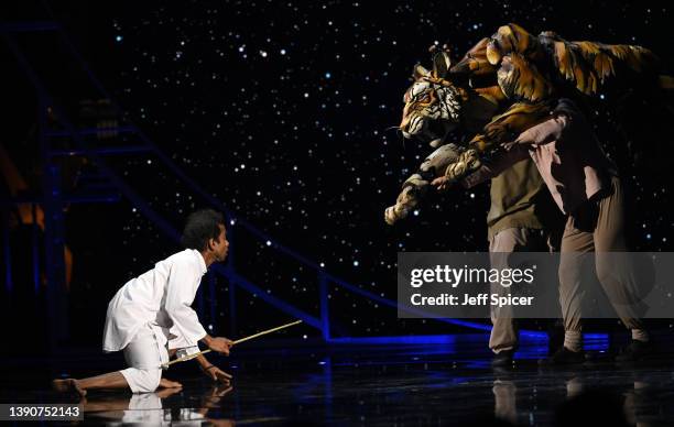 Hiran Abeysekera performs on stage with the cast of "Life of Pi" during The Olivier Awards 2022 with MasterCard at the Royal Albert Hall on April 10,...