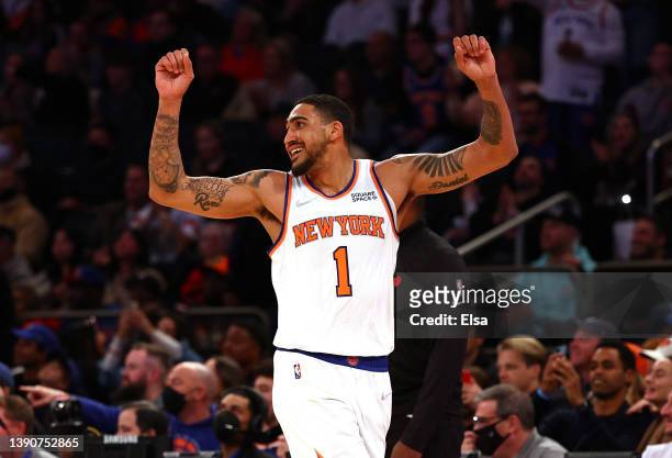 Obi Toppin of the New York Knicks celebrates late in the fourth quarter against the Toronto Raptors at Madison Square Garden on April 10, 2022 in New...