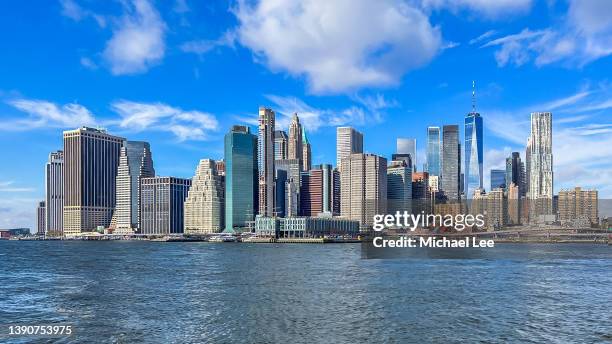 sunny lower manhattan skyline view - blue morning glory stock pictures, royalty-free photos & images