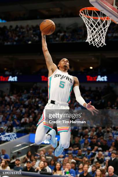 Dejounte Murray of the San Antonio Spurs dunks the ball in the first half against the Dallas Mavericks at American Airlines Center on April 10, 2022...