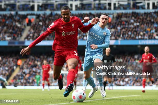 Phil Foden of Manchester City in action with Joel Matip opf Liverpool during the Premier League match between Manchester City and Liverpool at Etihad...
