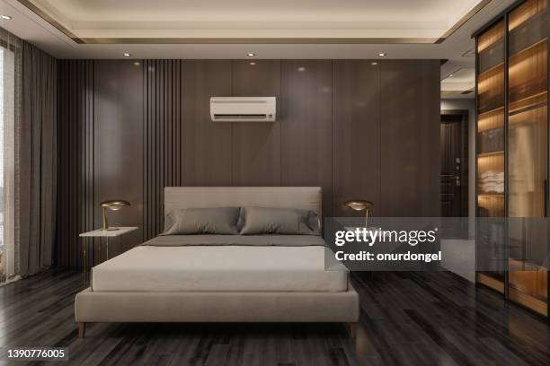 modern bedroom interior with front view of double bed, air conditioner and night tables - double bed stock pictures, royalty-free photos & images