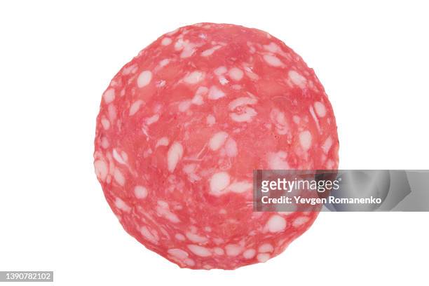 slice of salami isolated on white background - salami stock pictures, royalty-free photos & images