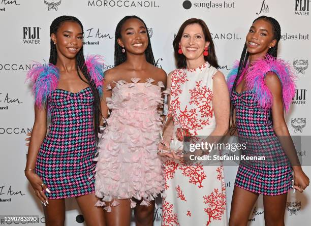 Lila Combs, Chance Combs, Lisa McKnight, recipient of the Fashion Influencer award, and Jessie Combs pose backstage during the Daily Front Row's...