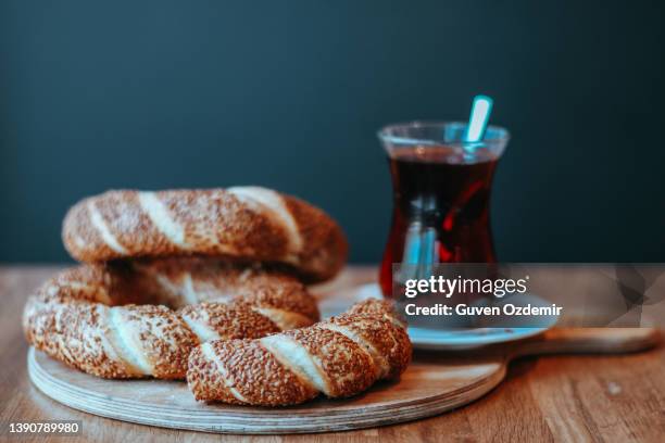 traditional turkish bagel, breakfast, turkish breakfast with turkish bagel on wooden background (turkish name; bagel or cereal), bagel with turkish tea - turkish bagel stock pictures, royalty-free photos & images