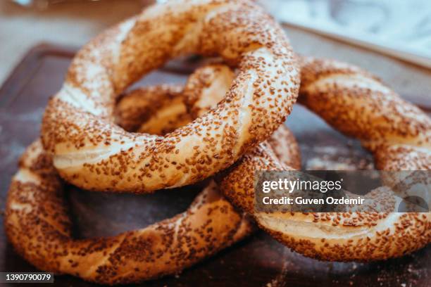 traditional turkish bagel bagel, breakfast, on a wooden background turkish breakfast with turkish bagel (turkish name; bagel or cereal) - turkish bagel stock pictures, royalty-free photos & images