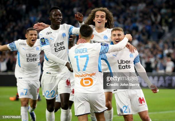 Cengiz Under of Marseille celebrates his goal on a penalty kick with Amine Harit, Pape Gueye, Matteo Guendouzi, Valentin Rongier during the Ligue 1...