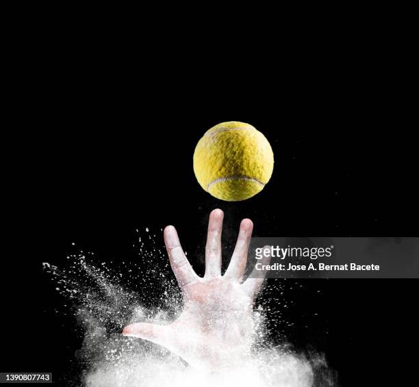 hands of a tennis player catching a ball. - ballon rebond stock pictures, royalty-free photos & images