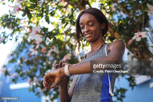 A Young African woman exercising outdoors.