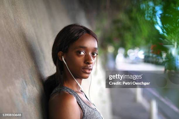 A Young African woman exercising outdoors.