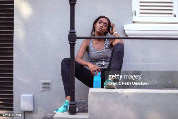 A Young African woman exercising outdoors.