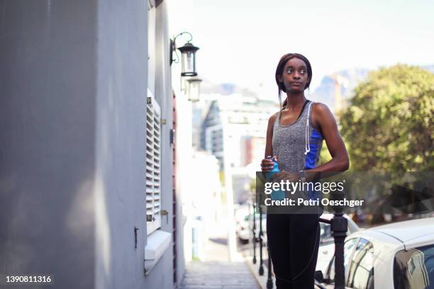 A Young African woman exercising outdoors.