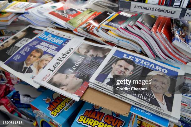 The front pages of the French newspapers, Liberation, Le Parisien, Les Echos and Le Figaro are displayed in a newsstand with the photos of Emmanuel...