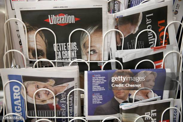 The front pages of the French newspapers, Liberation, La Croix, Le Parisien and Le Figaro are displayed in a newsstand with the photos of Emmanuel...