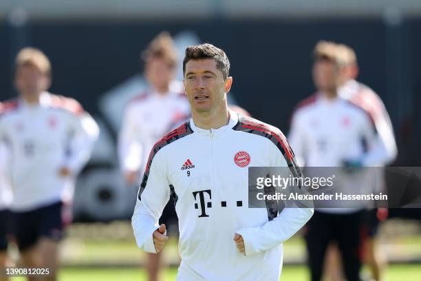 Robert Lewandowski of FC Bayern München looks on during a training session at Saebener Strasse training ground on April 11, 2022 in Munich, Germany....