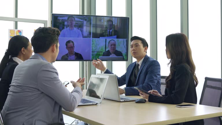 Business team in a video conference highlighting network needs