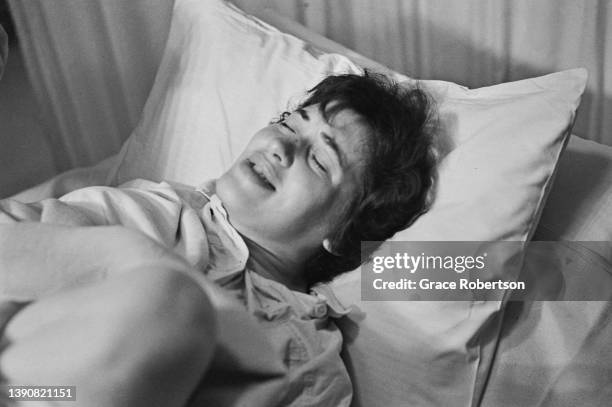 Woman in pain as she pushes during labor, UK, 1956. Original Publication: Picture Post - 9111 - Analgesia - unpub.