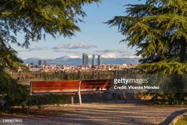 park bench with panoramic view to the north of madrid - madrid park stock pictures, royalty-free photos & images