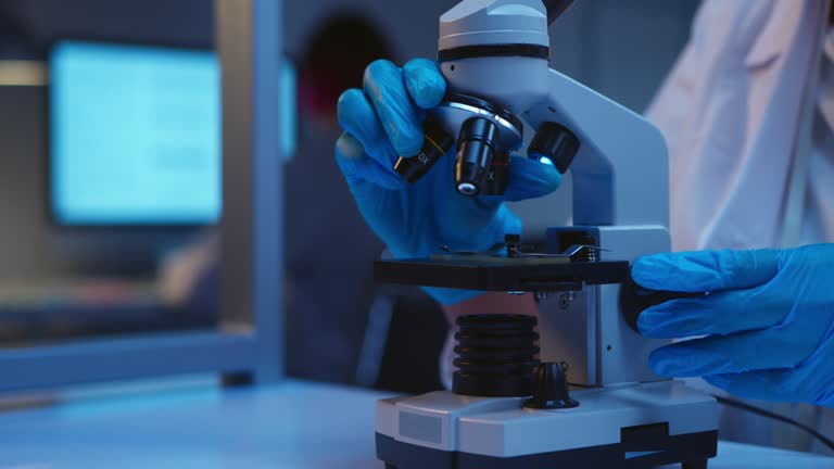 Science Microscope Video 652 African American Scientist Looking Into Microscope Stock Videos ...