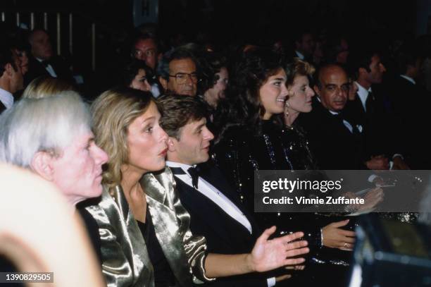 American artist Andy Warhol , American model and actress Lauren Hutton, Soviet-born Latvian-American dancer, choreographer and actor Mikhail...