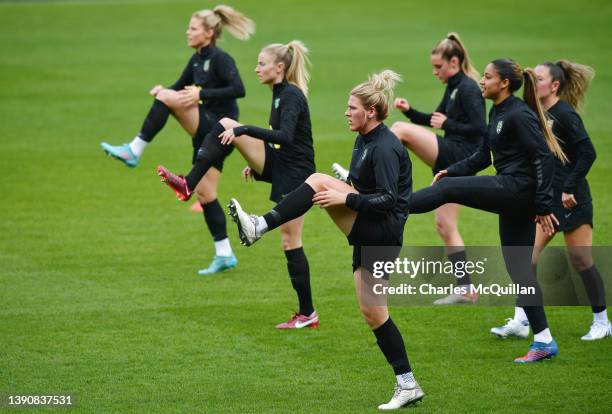 Millie Bright of England warms up with teammates during a training session ahead of their 2023 FIFA Women's World Cup qualifier match against...