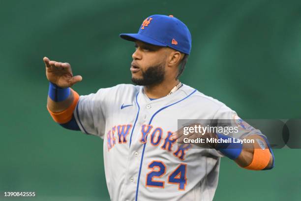 Robinson Cano of the New York Mets looks on before a baseball game against the Washington Nationals at the Nationals Park on April 8, 2022 in...