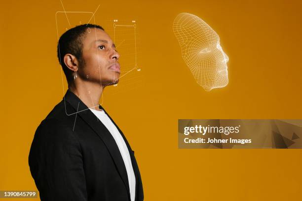 3d face mapping of young man - facial recognition technology stock-fotos und bilder