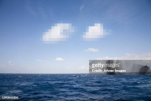 pixelated clouds in blue sky and sea - gdrp foto e immagini stock
