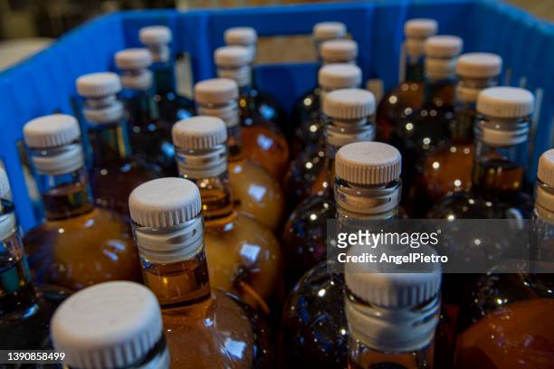 still life with bottles of apple liquor - apple cider vinegar stock pictures, royalty-free photos & images