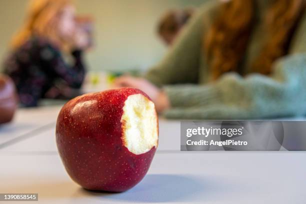 still life with a bitten apple - apple with bite stock pictures, royalty-free photos & images