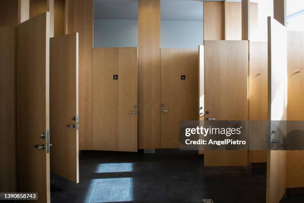 open and close doors in a public toilette - toilet door stock pictures, royalty-free photos & images