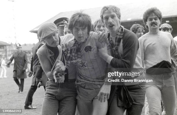 Newcastle United striker Peter Beardsley is congratulated by Newcastle Fans on the pitch after a 2-2 draw against Huddersfield Town which seals...