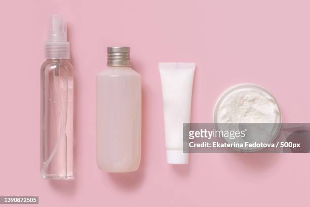 cosmetics in plastic tubes and bottles on pink top view mockup - trasparente stock pictures, royalty-free photos & images