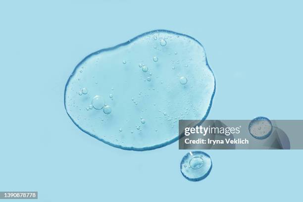 smears of gel,  face serum, shampoo, soap with oxygen aqua bubbles  on pastel blue color background. - amino acid foto e immagini stock