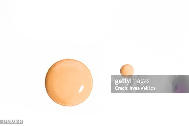 round smears of thick make-up face foundation  on white background. - brown powder stock pictures, royalty-free photos & images