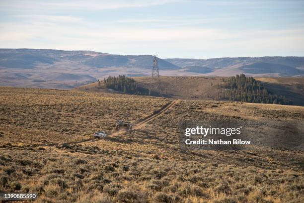 rural electrical linemen burial - zoom out stock pictures, royalty-free photos & images
