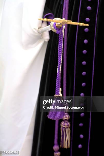 people dressed in purple for holy week - penitente people fotografías e imágenes de stock