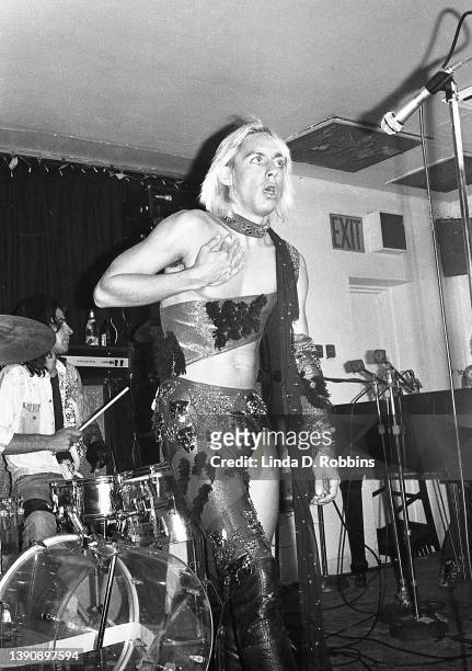 Iggy Pop performing with the Stooges at Max's Kansas City, prior to cutting his bare chest, New York, 31st July 1973. At left, drummer Scott Asheton.