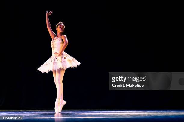 black girl dancing raymonda ballet on stage - estilo clássico imagens e fotografias de stock